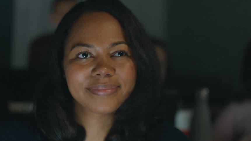 Minority student listens to a lecture in college classroom