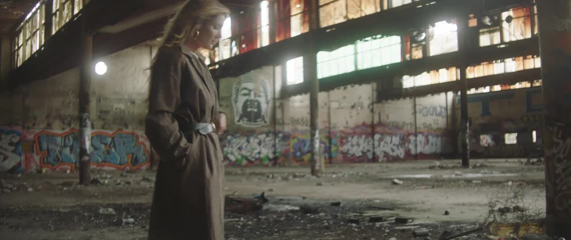 A woman walking around in a warehouse