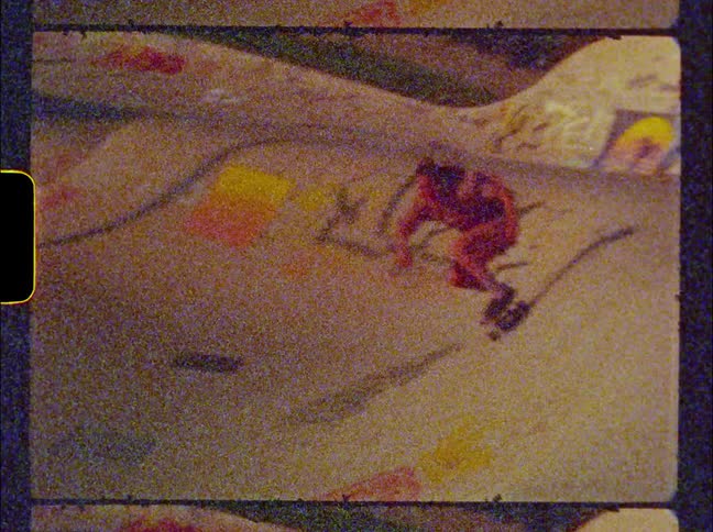 Skateboarding woman rides board along bowl at park