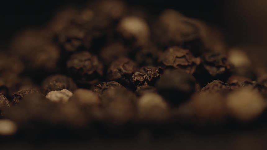 Blueberries in a pile drying and wrinkling Black Pepper
