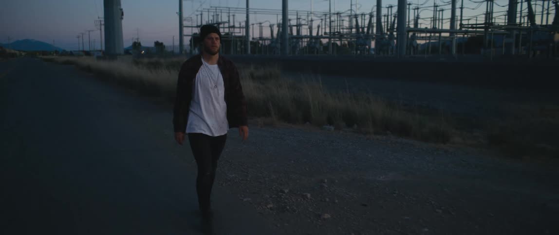 A man walks down the road