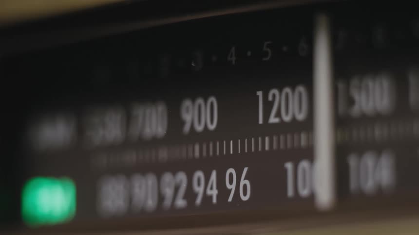 The radio dial has a green light