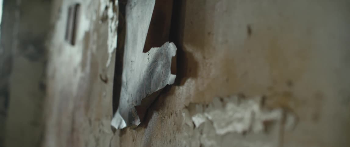 The paint is peeling on the wall