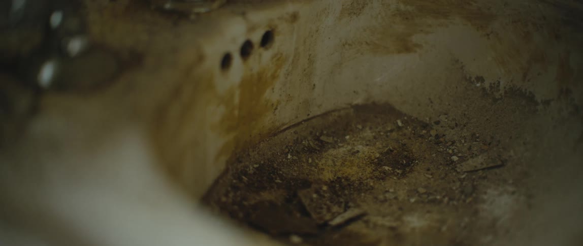 The sink is covered in dirt