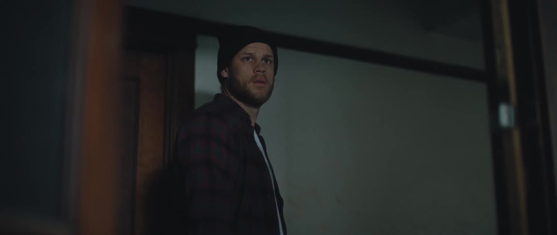 A man walks down the hall