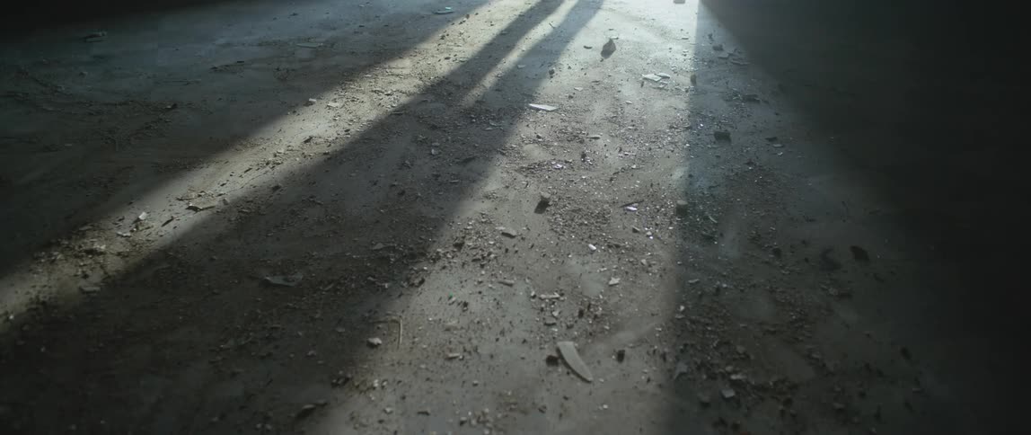 A person walks in the dark room