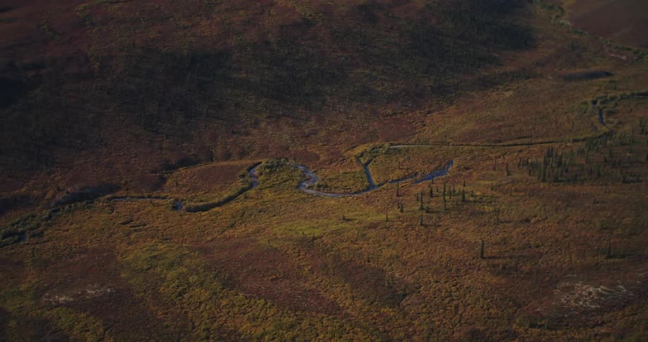 An aerial view of a canyon with a river in it