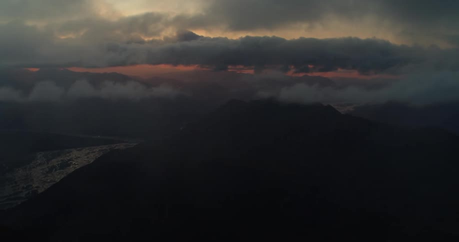 An aerial view of clouds above a river