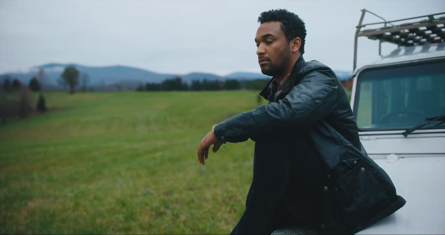 Man looks confidently into the countryside