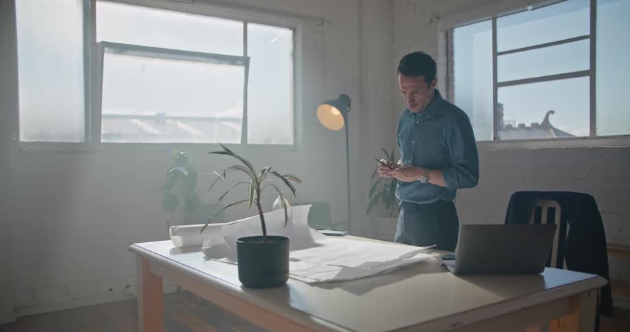 A man standing around in an office