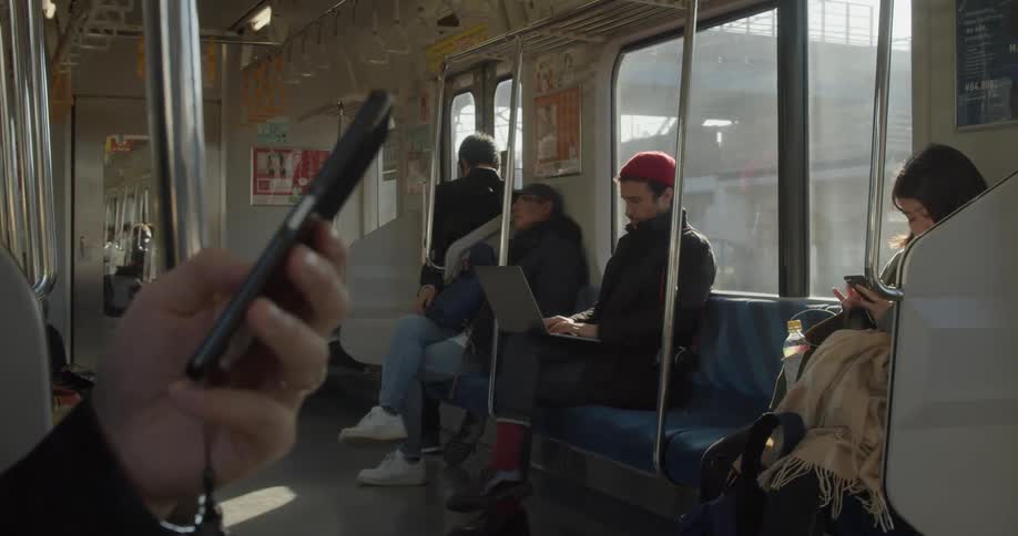 Man uses a laptop while traveling on the train