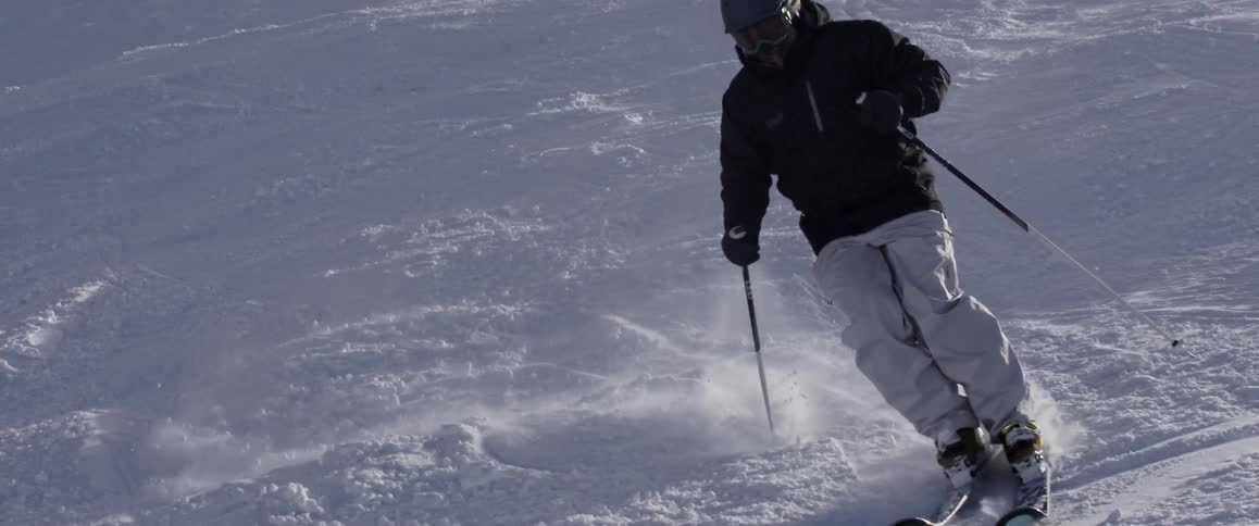 Person skis down a hill