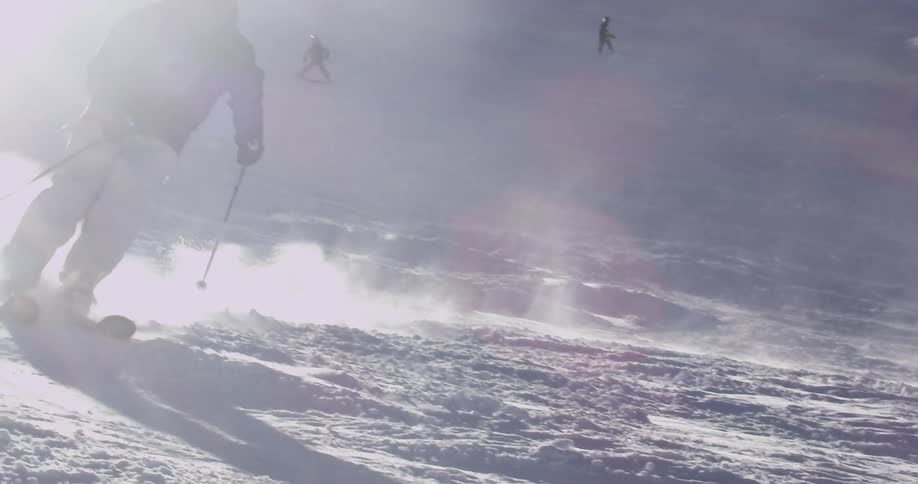 People are skiing down a slope