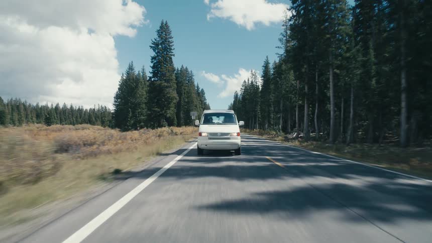 A van drives down the road