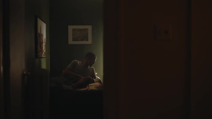 A man wakes up from bed