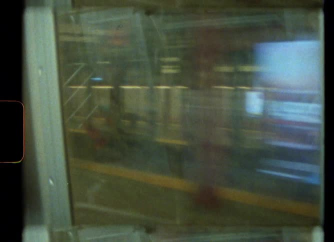 A public transportation bus is moving in the terminal