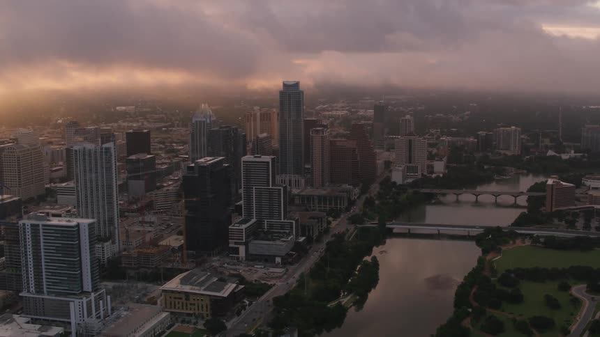 A river through a metropolis on a cloudy evening