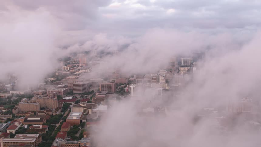 Clouds floating over a metropolis during the day