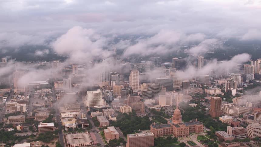 Clouds float over a metropolis during the day