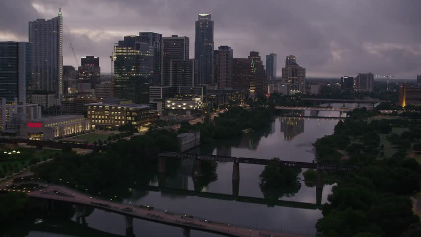 Bridges over a river connect downtown with a city park