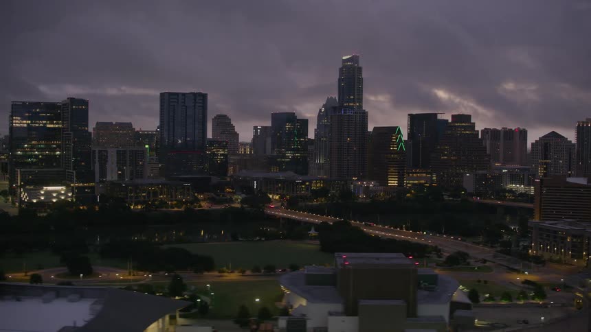 Aerial view of skyscrapers in a city during sunset