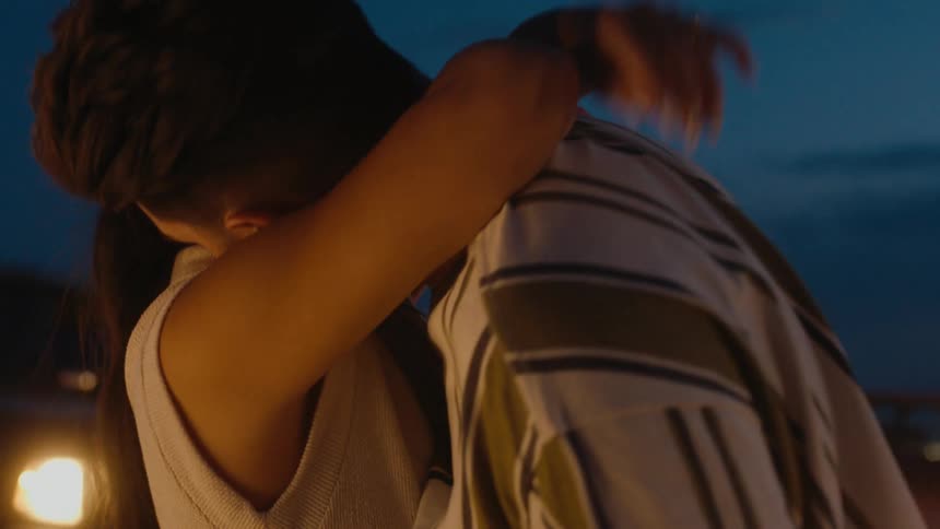 Two people dancing outdoors