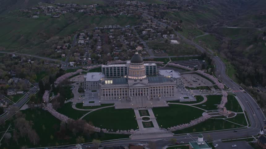 Aerial view of a government building in a city is displayed