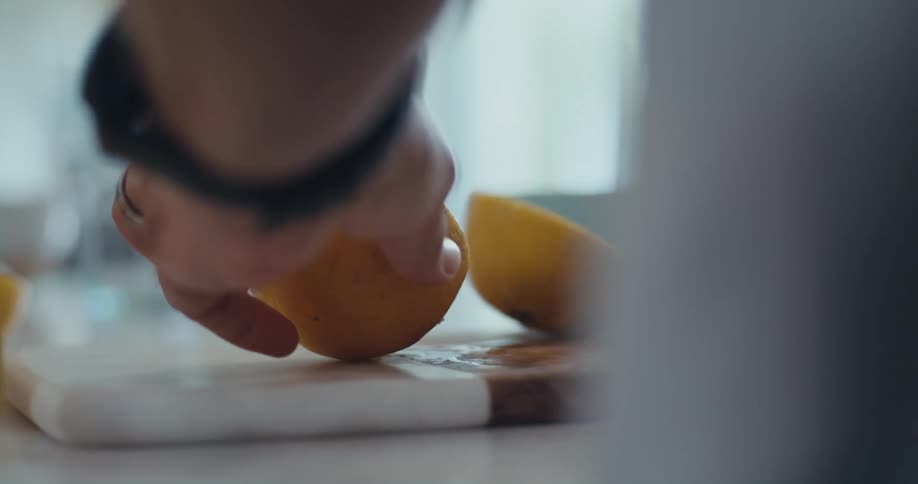 A person cuts an orange