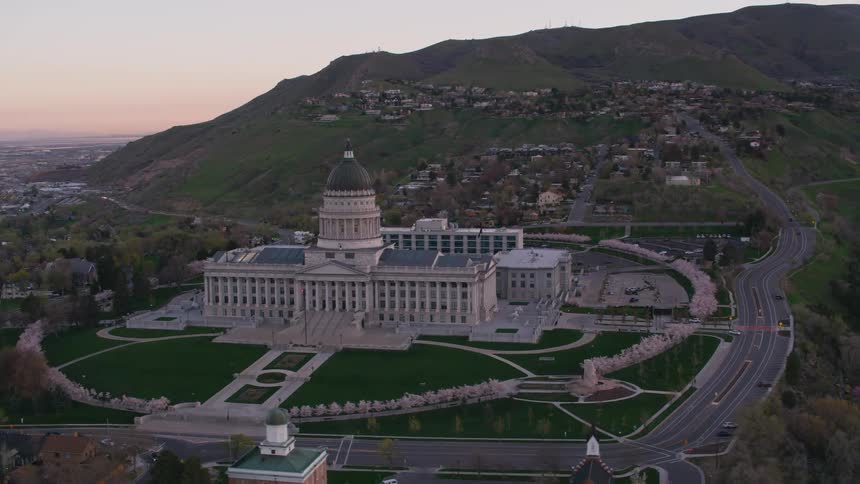 A large building sits on the hill