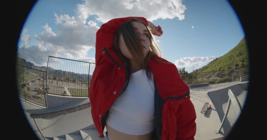 A woman poses outside