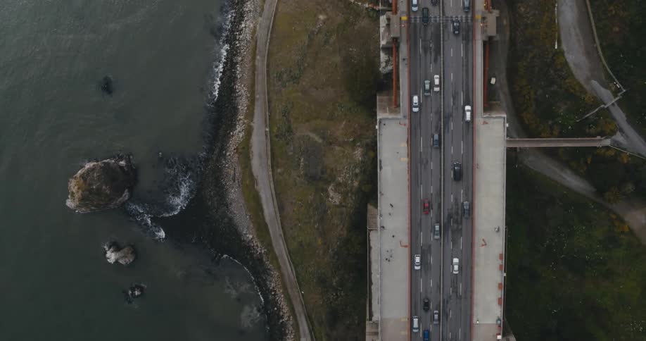 Cars driving on a road along the coast