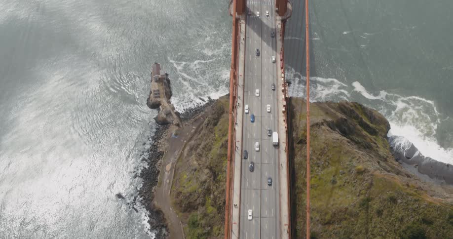 Vehicles drive over the large bridge