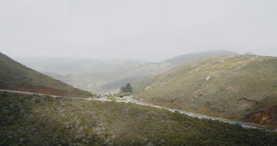 Aerial view of mountain road with roundabout