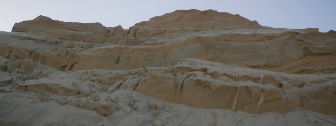 Sand sifting down a canyon