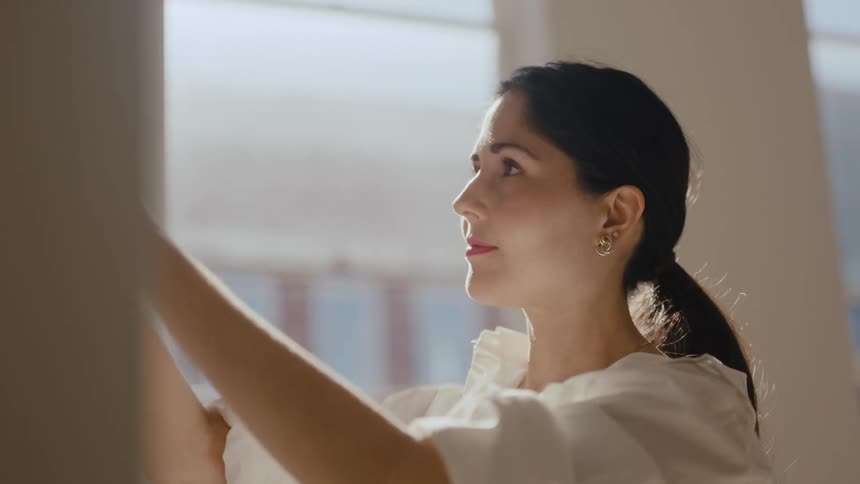 A woman posting elements for a presentation