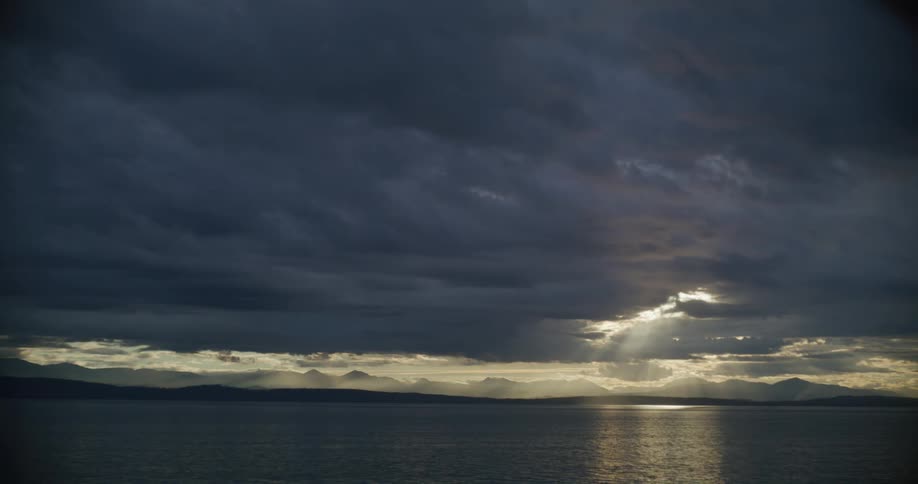 A view of the ocean with clouds above it