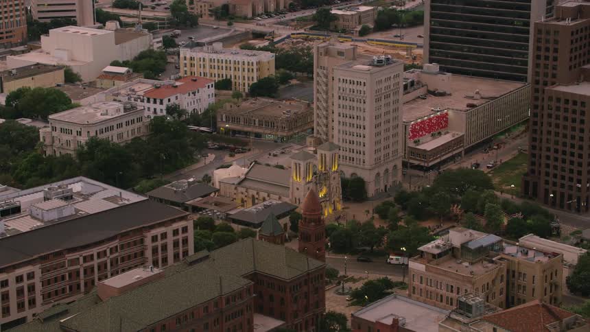 Vehicles drive through a sprawling downtown