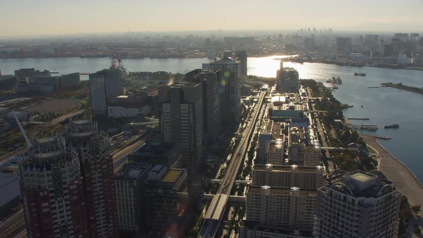 Aerial view of high rise buildings next to river in the big city