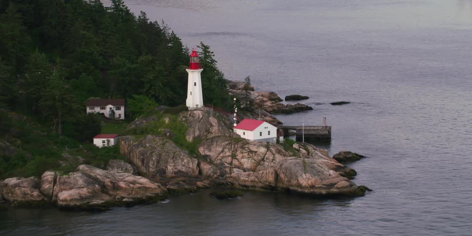 A lighthouse is near the shore