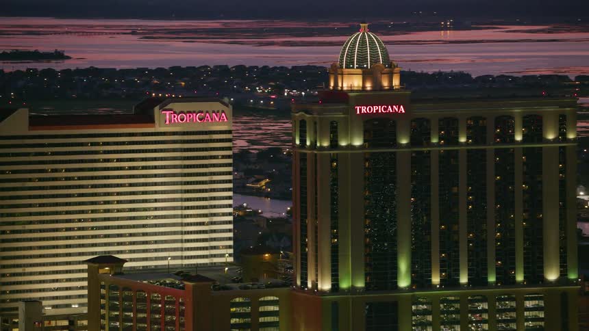 Aerial view of tall buildings in a city is displayed during the sunset
