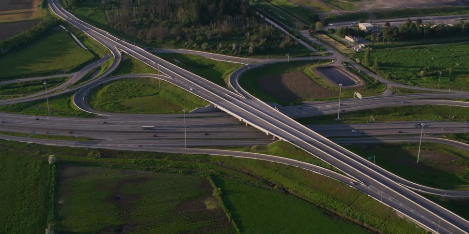 A large interchange on a freeway in the countryside during the day