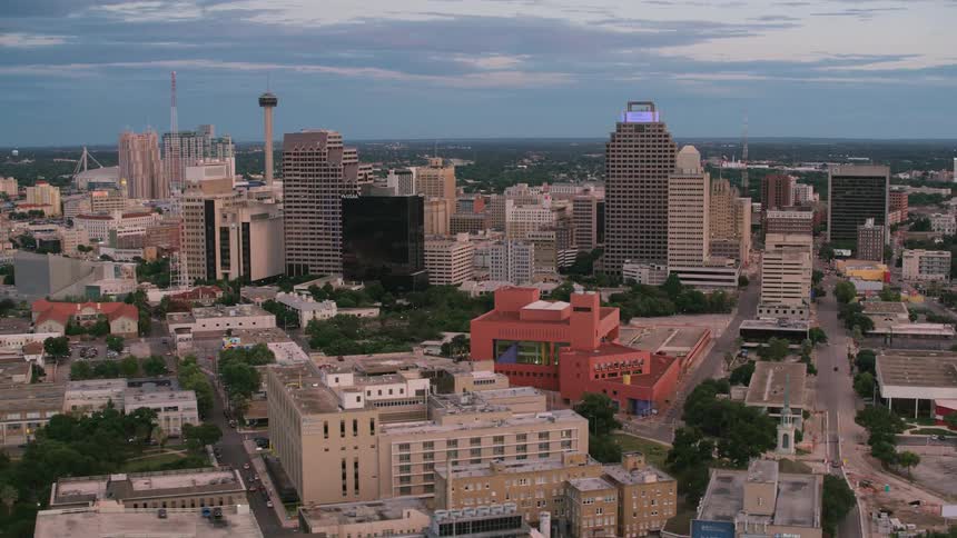 Aerial view of a downtown city is displayed