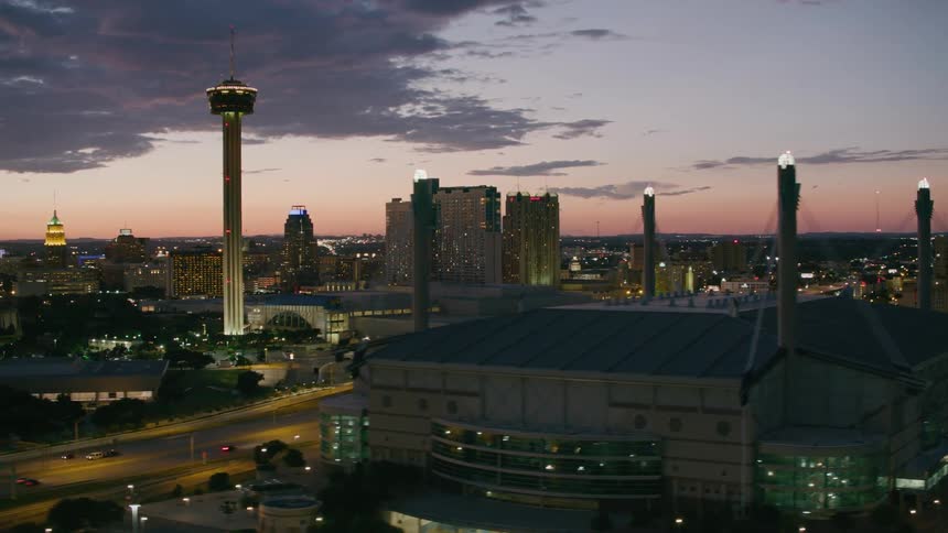 The tower of americas and other buildings in the city of san antonio after sunset