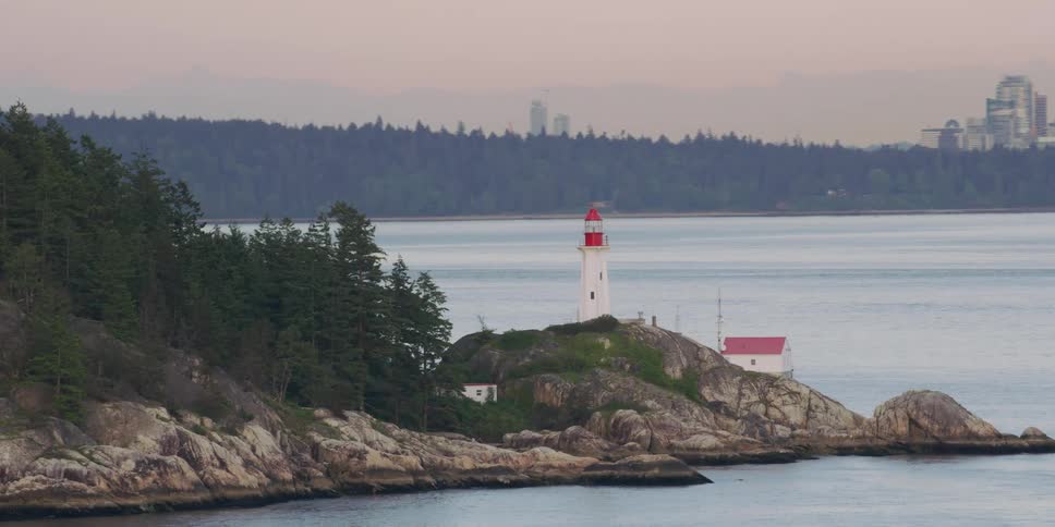 A lighthouse is on the shore