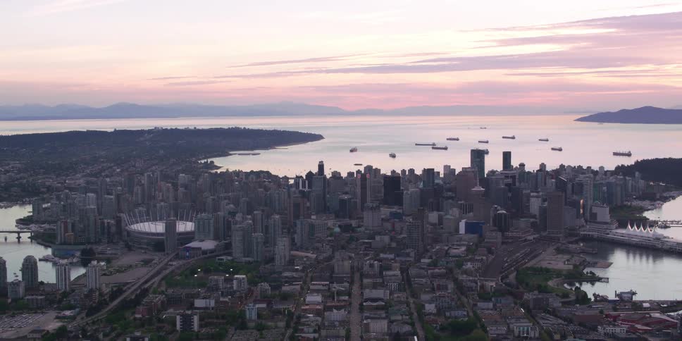 The sun is rising on the city