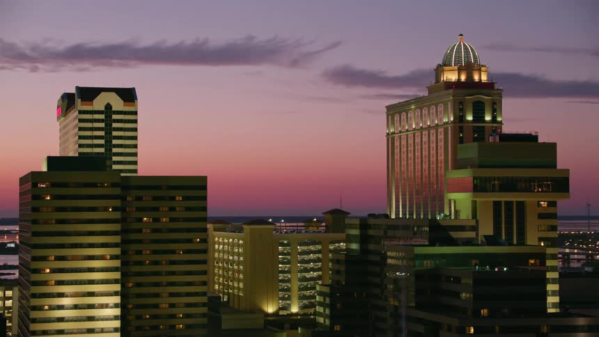 Atlantic city skyscraper lights glowing at dusk