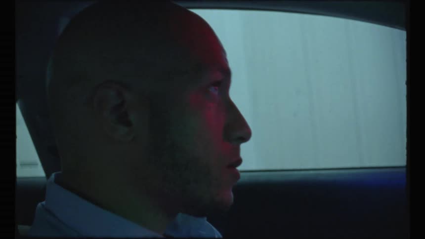A man is driving in the rain