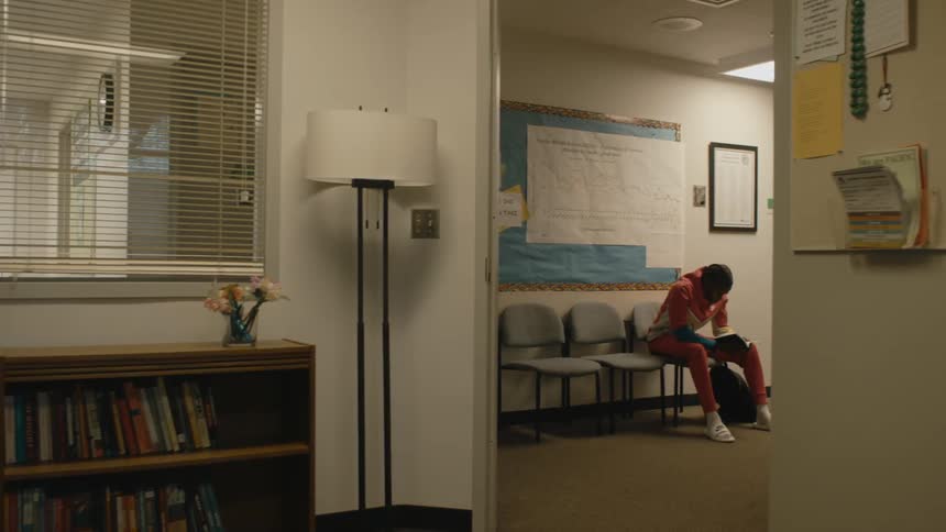 A student walks down the hall in school