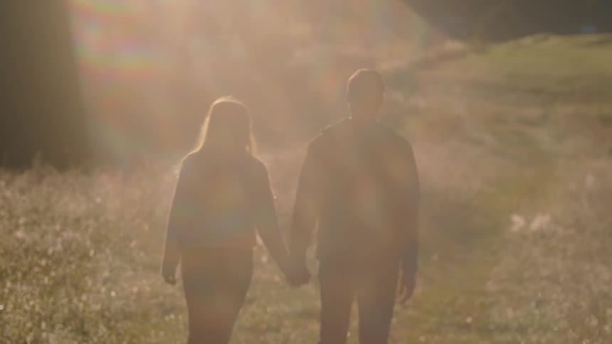 Two people walking outdoors
