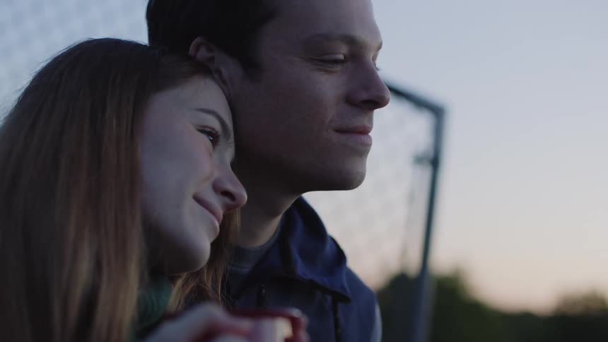 A young couple look content together
